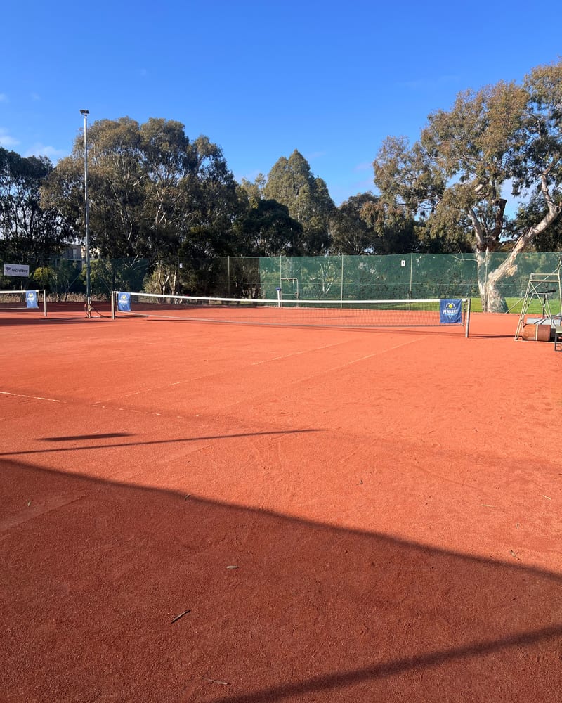 Members playing doubles at Norris Bank Tennis Club