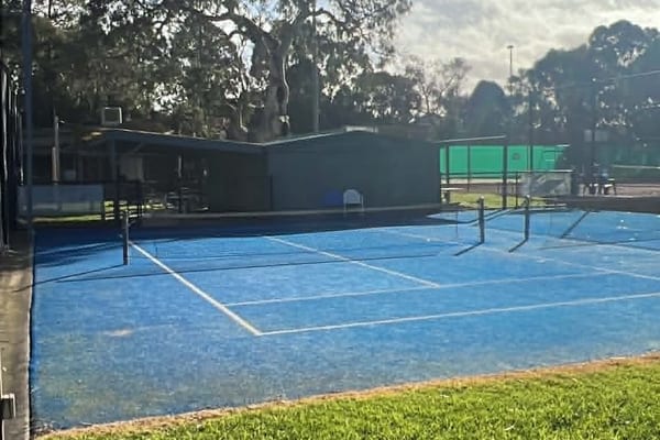 Blue tennis courts outdoor facility
