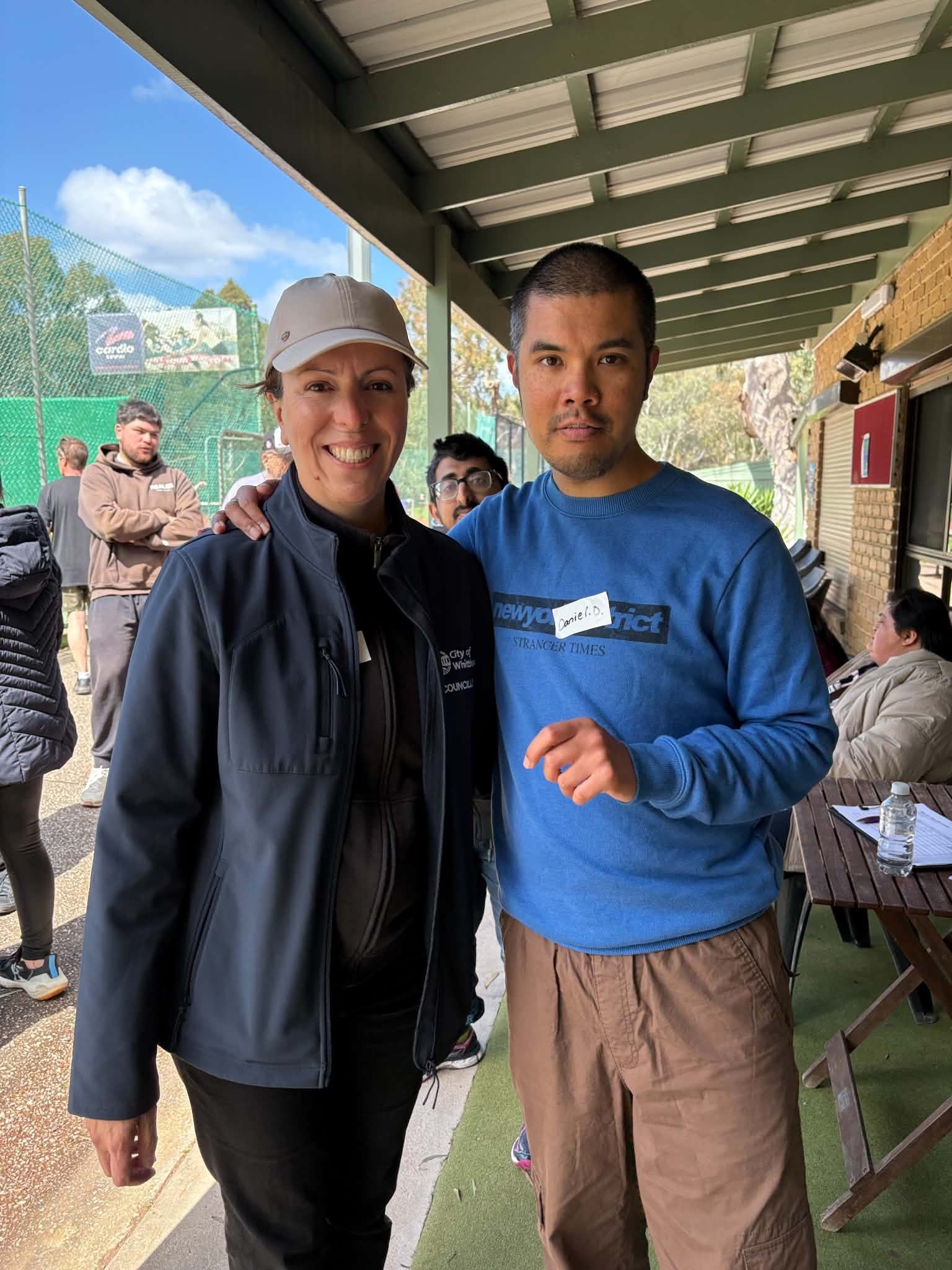 City of Whittlesea councillor posing with a participant under the covered patio