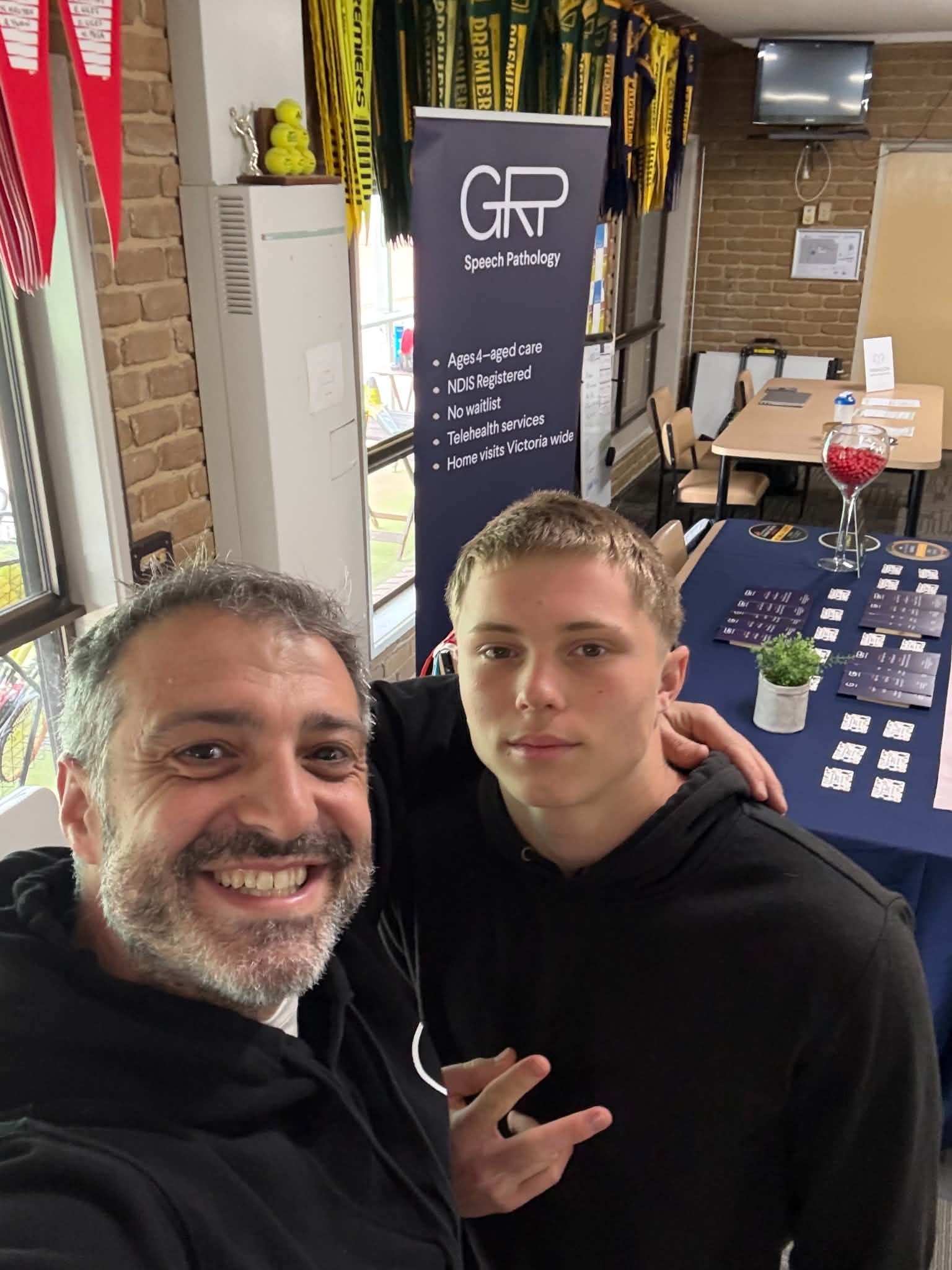 Two people at the GRP Speech Pathology booth