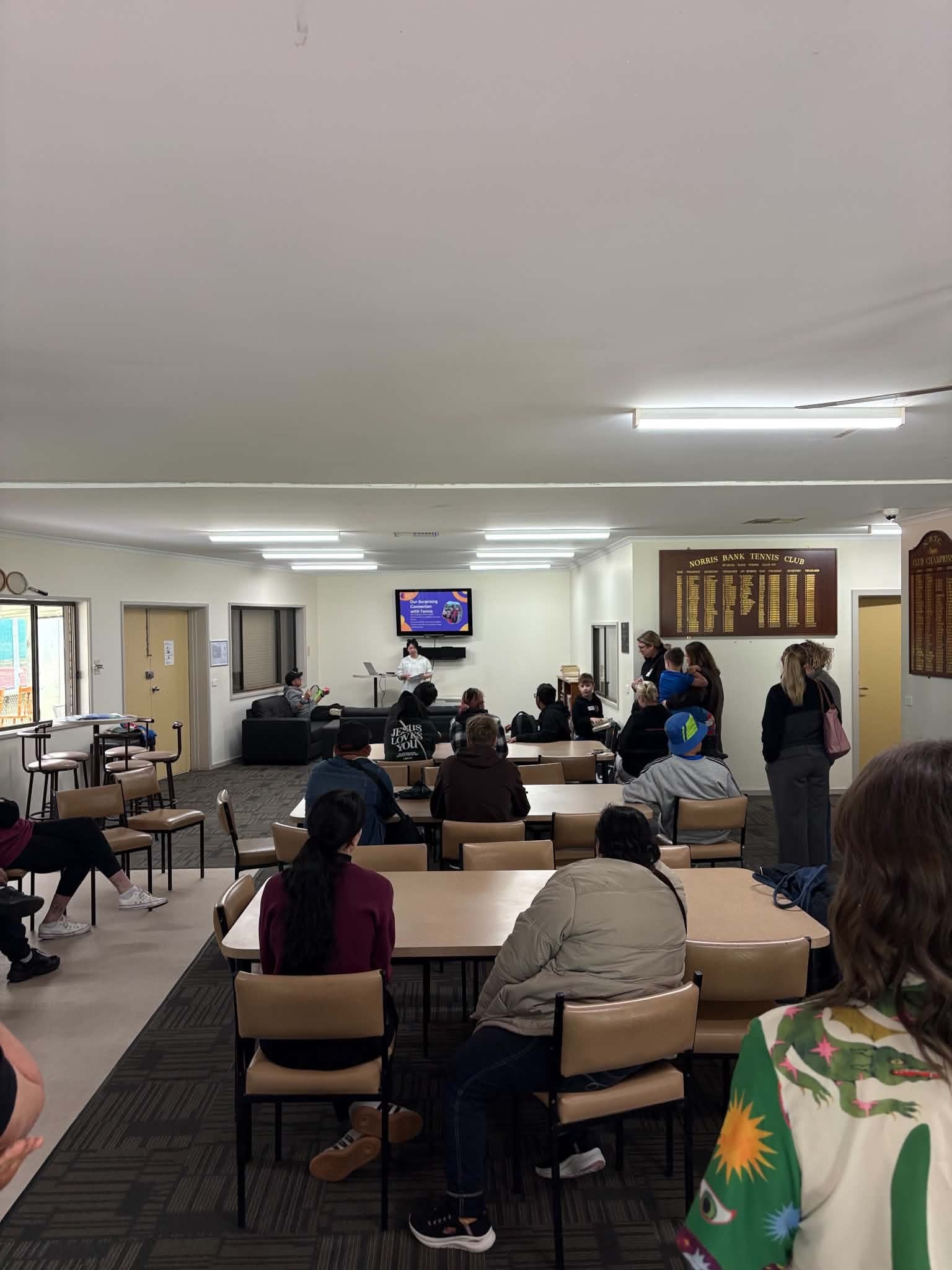 Full room view of the Tennis Together Day gathering at Norris Bank